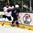 GRAND FORKS, NORTH DAKOTA - APRIL 19: USA's Graham McPhee #21 and Switzerland's Elia Riva #27 battle for the loose puck during preliminary round action at the 2016 IIHF Ice Hockey U18 World Championship. (Photo by Minas Panagiotakis/HHOF-IIHF Images)

